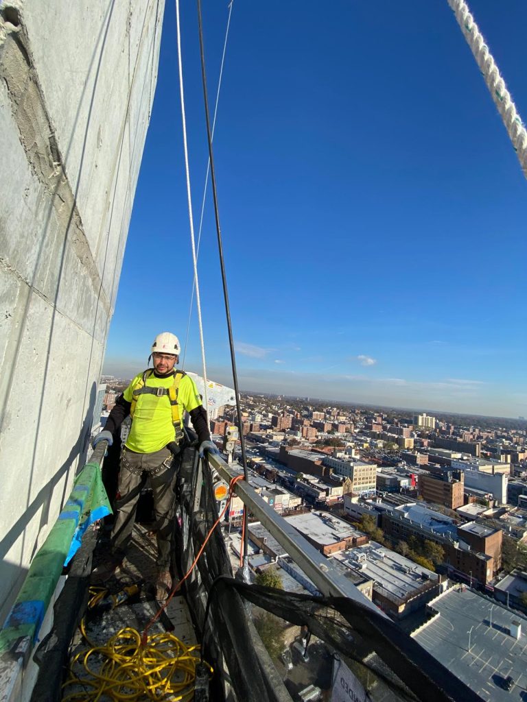 AST Alum on Scaffold NYC